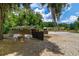 Outdoor horse paddock featuring two horses, shelter, and expansive space on a sunny day at 13300 Ne 38Th Ave, Anthony, FL 32617