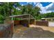 Horse stall featuring wood construction, shaded covering, and sand/wood chip flooring at 13300 Ne 38Th Ave, Anthony, FL 32617