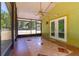 View of the screened-in lanai with tile flooring and a view of the yard at 13300 Ne 38Th Ave, Anthony, FL 32617