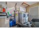 Well-equipped laundry area with modern washer and dryer, utility sink, and storage cabinets at 13300 Ne 38Th Ave, Anthony, FL 32617