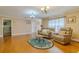 Open living space with comfortable seating and tile flooring at 13300 Ne 38Th Ave, Anthony, FL 32617