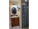 Bathroom featuring a stylish vanity, mirror, and a shower with patterned curtain at 137 Juniper Loop, Ocala, FL 34480