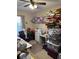 Bedroom used for storage, with a window, a desk, and personal items throughout the room at 137 Juniper Loop, Ocala, FL 34480