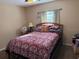 Cozy bedroom with a comfortable bed, neutral walls, and a window to let in natural light at 137 Juniper Loop, Ocala, FL 34480
