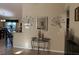 This entryway features neutral walls, decorative wall art, and a console table at 137 Juniper Loop, Ocala, FL 34480