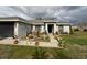 Charming single-story home featuring a well-maintained lawn and a beautiful garden at 137 Juniper Loop, Ocala, FL 34480