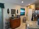 Kitchen features tile floors, stainless appliances, and custom wood cabinets and granite countertops at 137 Juniper Loop, Ocala, FL 34480