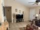 Bright living room featuring tile floors, a ceiling fan, and neutral paint at 137 Juniper Loop, Ocala, FL 34480