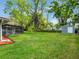 The backyard has trees and a shed at 1505 Se 27Th Ter, Ocala, FL 34471