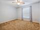 Bedroom with ceiling fan and cozy carpet at 1505 Se 27Th Ter, Ocala, FL 34471