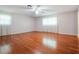 Spacious bedroom with gleaming hardwood floors and abundant natural light at 1505 Se 27Th Ter, Ocala, FL 34471