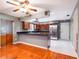 Spacious kitchen featuring wood cabinets, stainless steel appliances, and granite countertops at 1505 Se 27Th Ter, Ocala, FL 34471