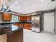 Updated kitchen with granite countertops, stainless steel appliances, and ample cabinet space at 1505 Se 27Th Ter, Ocala, FL 34471