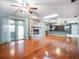 Bright living room with stone fireplace, hardwood floors and sliding door access at 1505 Se 27Th Ter, Ocala, FL 34471