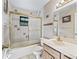 Bathroom with a tiled shower and tub combo and single sink vanity at 16 Northern Dancer Dr, Ocala, FL 34482