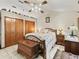 Bedroom showcasing vaulted ceiling, and wooden furniture including 2 closets at 16 Northern Dancer Dr, Ocala, FL 34482