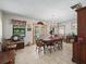 Dining room with tile floor, and doors to the patio and backyard pool at 16 Northern Dancer Dr, Ocala, FL 34482