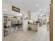 Open kitchen with a dining area, tile flooring, and access to outdoor views for an enjoyable cooking and dining experience at 16 Northern Dancer Dr, Ocala, FL 34482