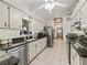 Traditional kitchen featuring granite counters, stainless steel appliances, and white cabinetry at 16 Northern Dancer Dr, Ocala, FL 34482
