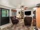 Cozy living room with a patterned rug and ceiling fan at 16 Northern Dancer Dr, Ocala, FL 34482