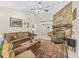 Cozy living room with a stone fireplace, comfortable seating, and a warm, inviting atmosphere at 16 Northern Dancer Dr, Ocala, FL 34482