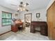 Office featuring two desks and a ceiling fan at 16 Northern Dancer Dr, Ocala, FL 34482