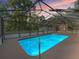 Enclosed pool with a screened enclosure for year-round enjoyment and protection from the elements at 16 Northern Dancer Dr, Ocala, FL 34482