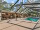 Screened-in pool with ample deck space for lounging and entertaining in the backyard at 16 Northern Dancer Dr, Ocala, FL 34482