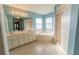 Bright bathroom with double vanity, soaking tub under windows and glass enclosed shower at 16201 Sw 47Th Ter, Ocala, FL 34473