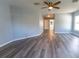 Bedroom with views to an ensuite bathroom and ceiling fan at 16201 Sw 47Th Ter, Ocala, FL 34473