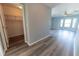 Bedroom displaying an open closet door and hard flooring at 16201 Sw 47Th Ter, Ocala, FL 34473