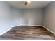 A spacious empty bedroom shows hard flooring and light blue walls at 16201 Sw 47Th Ter, Ocala, FL 34473