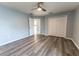 Spacious bedroom with laminate floors and large closet doors at 16201 Sw 47Th Ter, Ocala, FL 34473