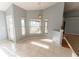 Bright dining area with large windows, tiled flooring, and a view of the backyard at 16201 Sw 47Th Ter, Ocala, FL 34473
