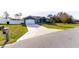 Beautiful view of the home, driveway and manicured lawn at 16201 Sw 47Th Ter, Ocala, FL 34473