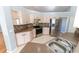 Well-lit kitchen featuring stainless steel appliances, light wood cabinets and tiled floors at 16201 Sw 47Th Ter, Ocala, FL 34473