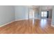 Open-concept living area featuring wood floors, neutral walls, and a welcoming entrance at 16201 Sw 47Th Ter, Ocala, FL 34473