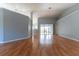 Spacious living room boasts wood floors, neutral paint, and sliding doors to the outdoor patio at 16201 Sw 47Th Ter, Ocala, FL 34473