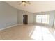 Spacious living room with a large window, neutral paint, and tile floors at 16201 Sw 47Th Ter, Ocala, FL 34473
