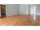 Well-lit living room boasting wood floors, neutral walls, and a hall closet nearby at 16201 Sw 47Th Ter, Ocala, FL 34473