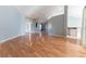 Open-concept living area featuring wood floors, neutral walls, and a welcoming entrance at 16201 Sw 47Th Ter, Ocala, FL 34473