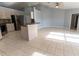 Open living space with kitchen, breakfast bar and large tile flooring bathed in sunlight at 16201 Sw 47Th Ter, Ocala, FL 34473