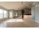 Bright open-concept living space with large windows and tile flooring, ideal for modern living at 16201 Sw 47Th Ter, Ocala, FL 34473