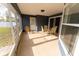 Covered patio with dining set and exterior access to the back yard at 16201 Sw 47Th Ter, Ocala, FL 34473