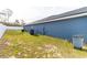 View of side yard featuring grass, a white fence, and the house at 16201 Sw 47Th Ter, Ocala, FL 34473