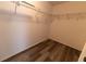 A walk-in closet with wooden laminate flooring and wire shelving at 16201 Sw 47Th Ter, Ocala, FL 34473