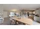 Bright and airy living space with a dining area, kitchen island, and elegantly arranged furnishings at 1698 Ne 161 St, Citra, FL 32113