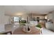 Stylishly staged living area with a dining space, kitchen island, and contemporary decor, creating an inviting atmosphere at 1698 Ne 161 St, Citra, FL 32113