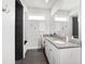 Modern bathroom featuring granite counters, undermount sink, and a tiled shower with a built-in bench at 1910 Se 28Th Pl, Ocala, FL 34471