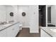 Modern bathroom featuring double sinks, granite countertops, and a walk-in shower at 1910 Se 28Th Pl, Ocala, FL 34471